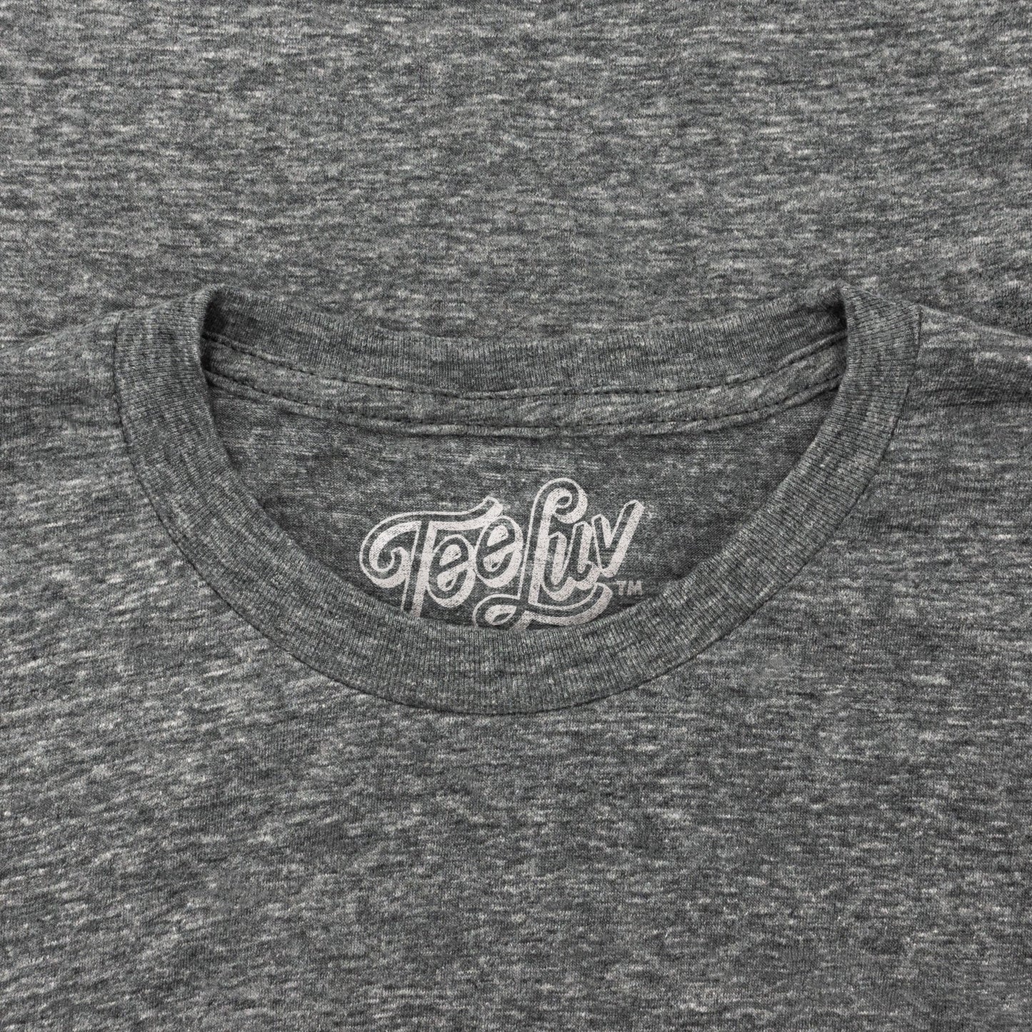 Gray t-shirt with 'Tee Luv' logo on the collar