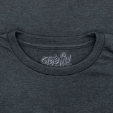 Close-up of a dark gray t-shirt with 'Tee Luv' logo on the neckline.