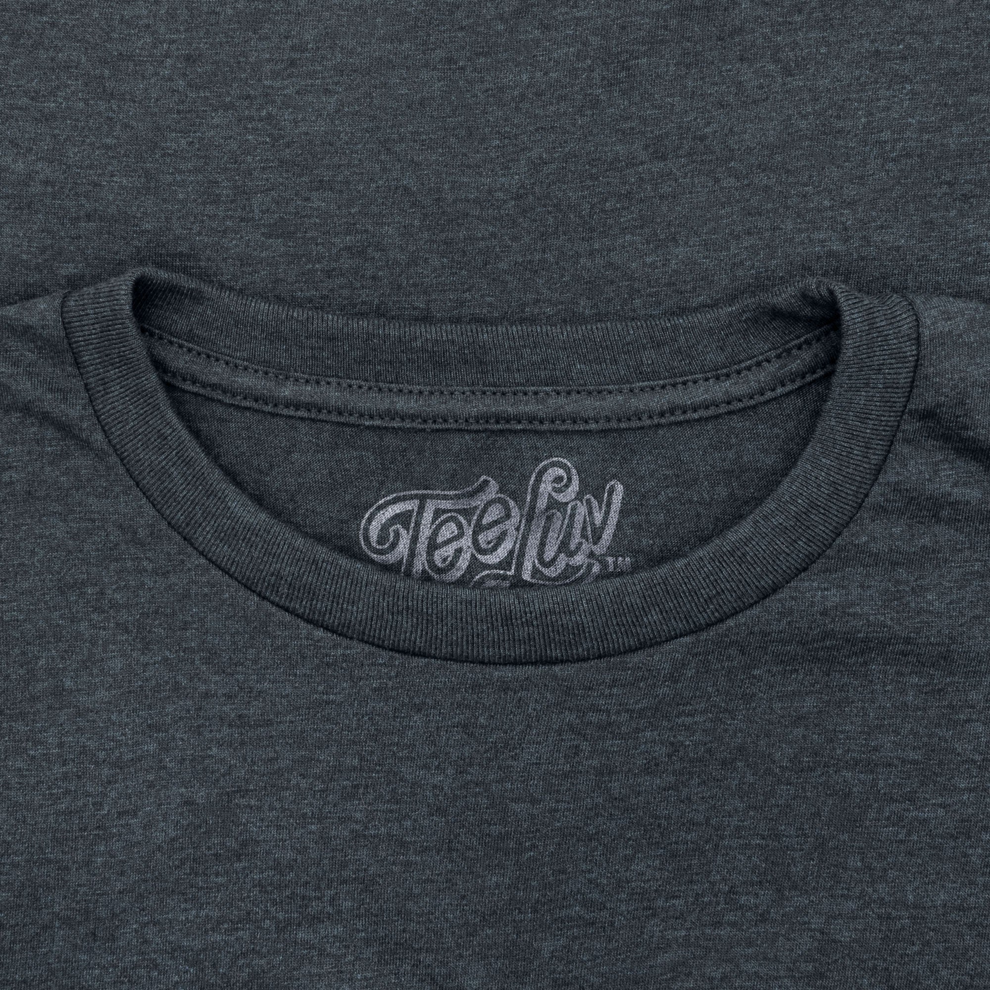 Close-up of a dark gray t-shirt with 'Tee Luv' logo on the neckline.