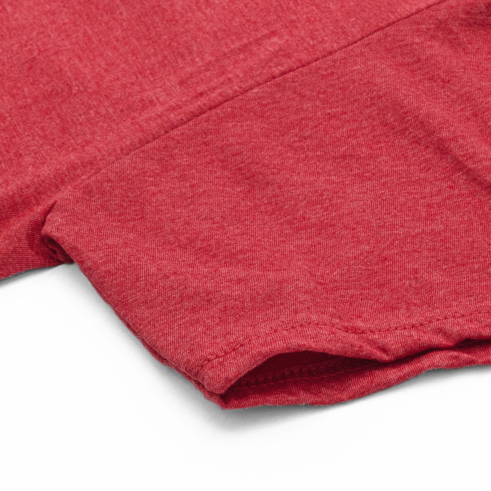Close-up of a red fabric texture on a white background