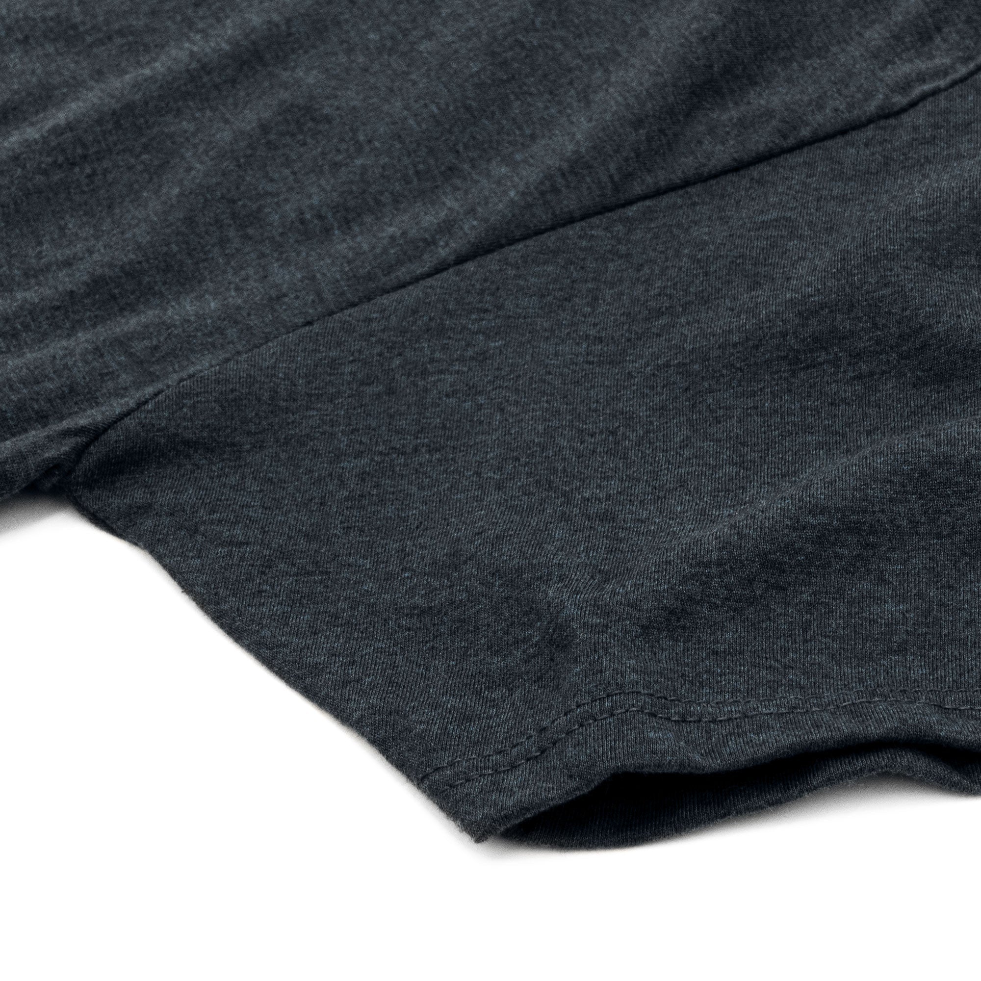Close-up of a dark gray fabric texture on a white background
