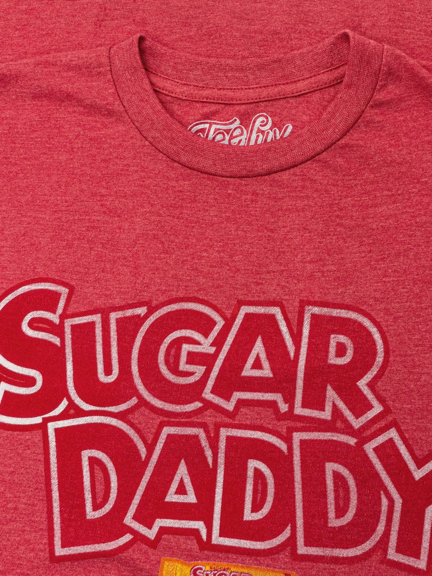 Red t-shirt with 'SUGAR DADDY' text and a logo on a red background