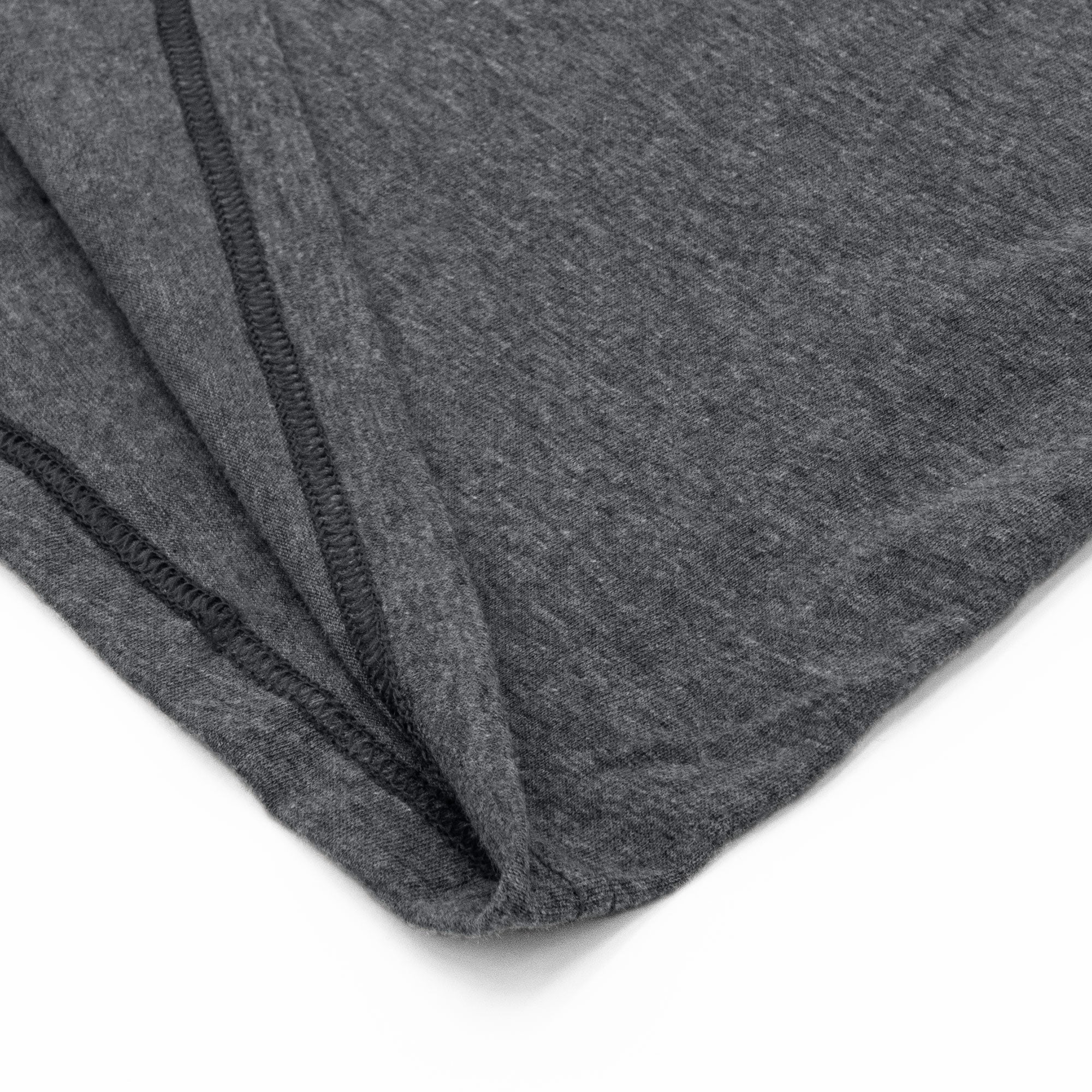 Close-up of gray fabric with a subtle pattern on a white background
