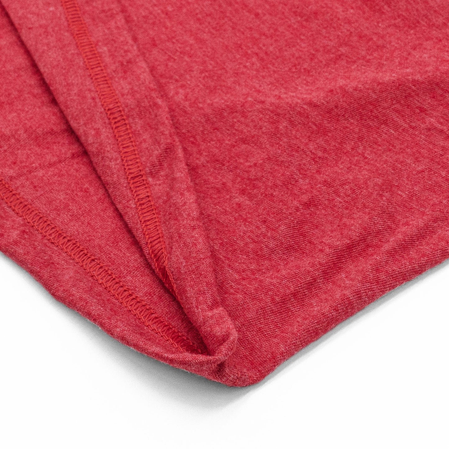 Close-up of a red fabric texture on a white background