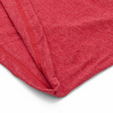 Close-up of a red fabric texture on a white background