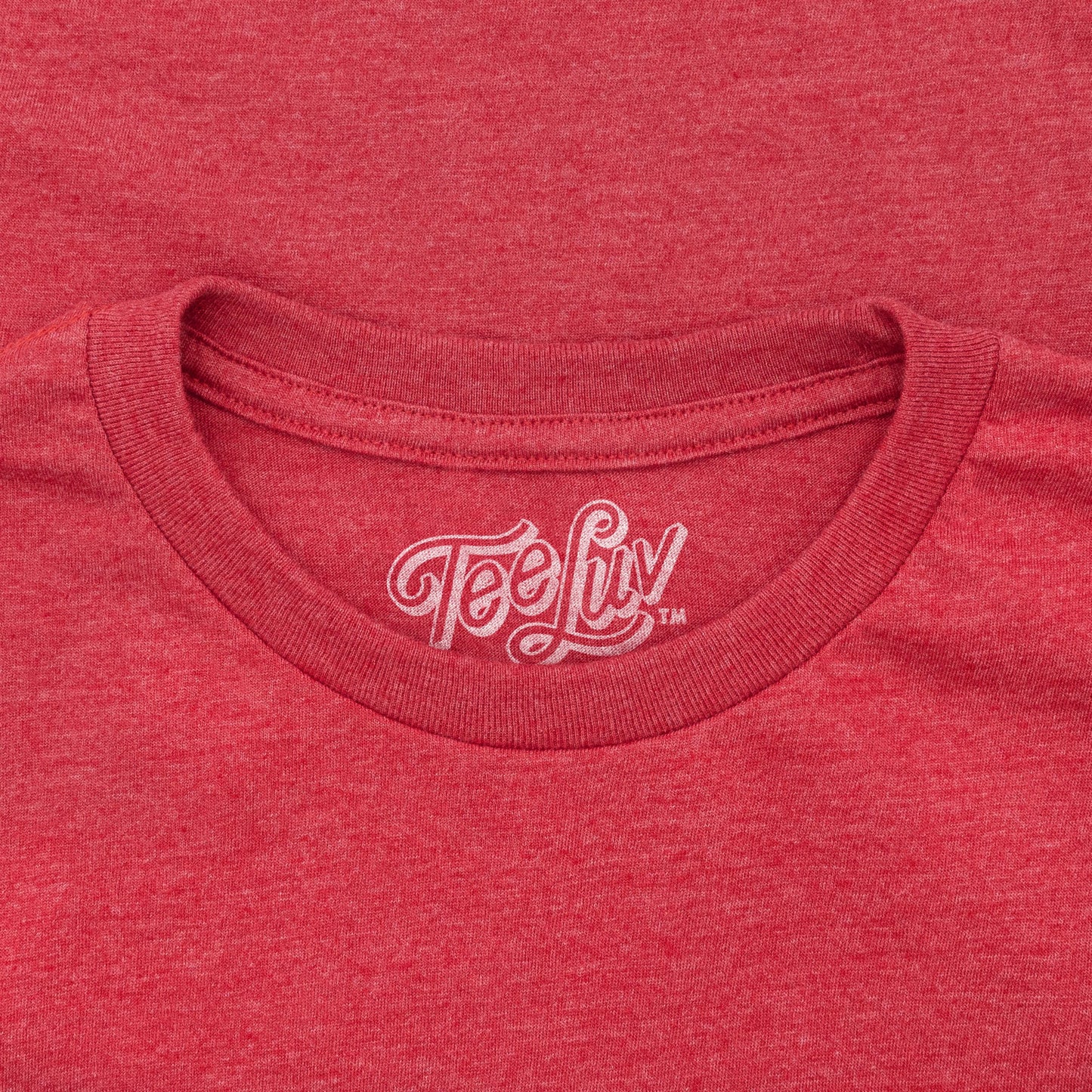 Red t-shirt with 'Tee Luv' logo on the collar