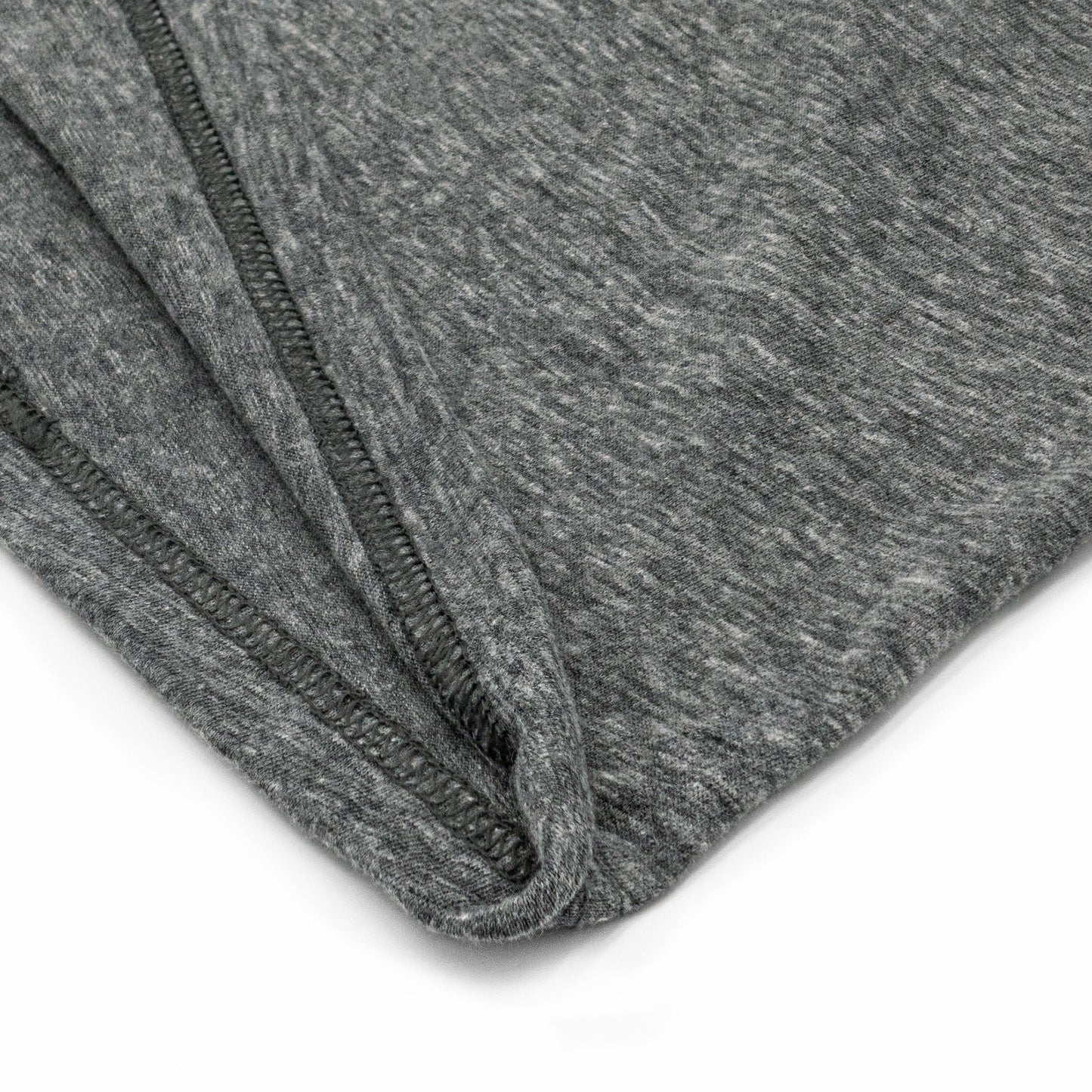 Close-up of gray fabric with a zipper on a white background
