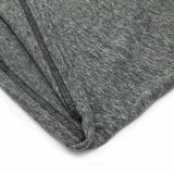 Close-up of gray fabric with a zipper on a white background