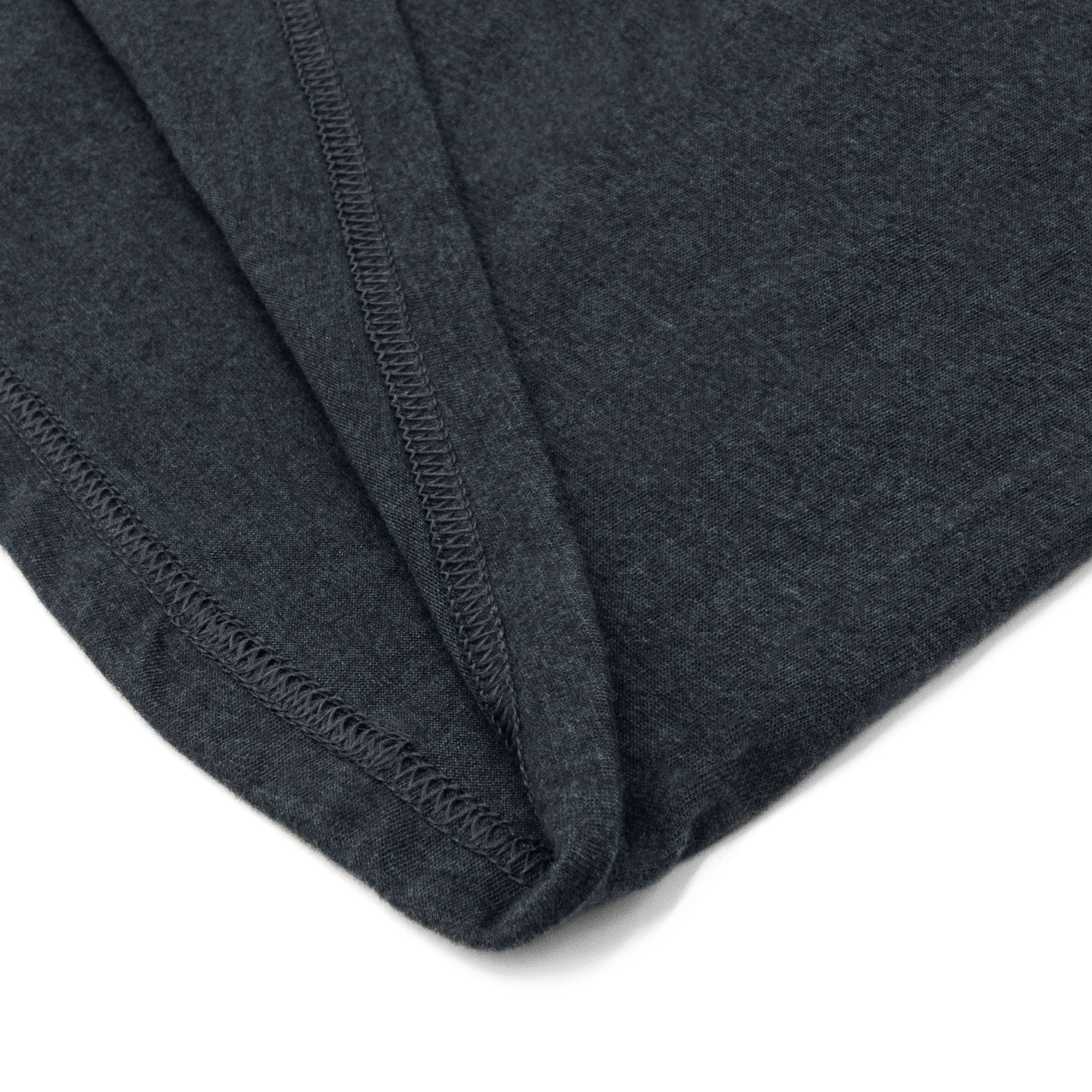 Close-up of dark gray fabric with a white background