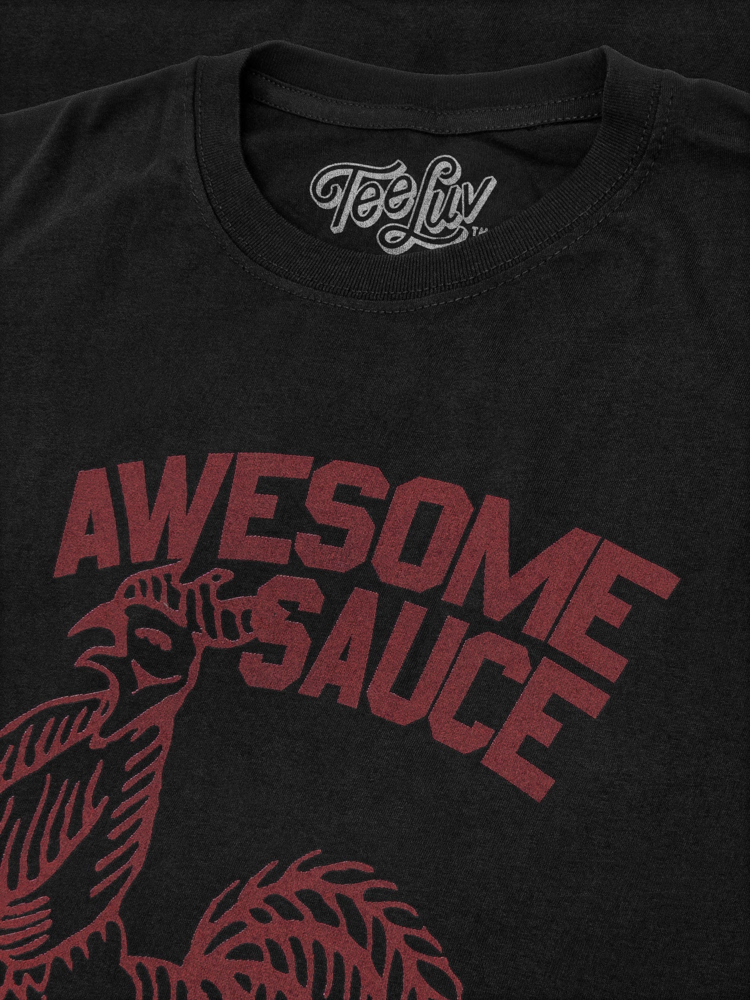 Black t-shirt with 'Awesome Sauce' text and graphic, featuring Teefly logo.