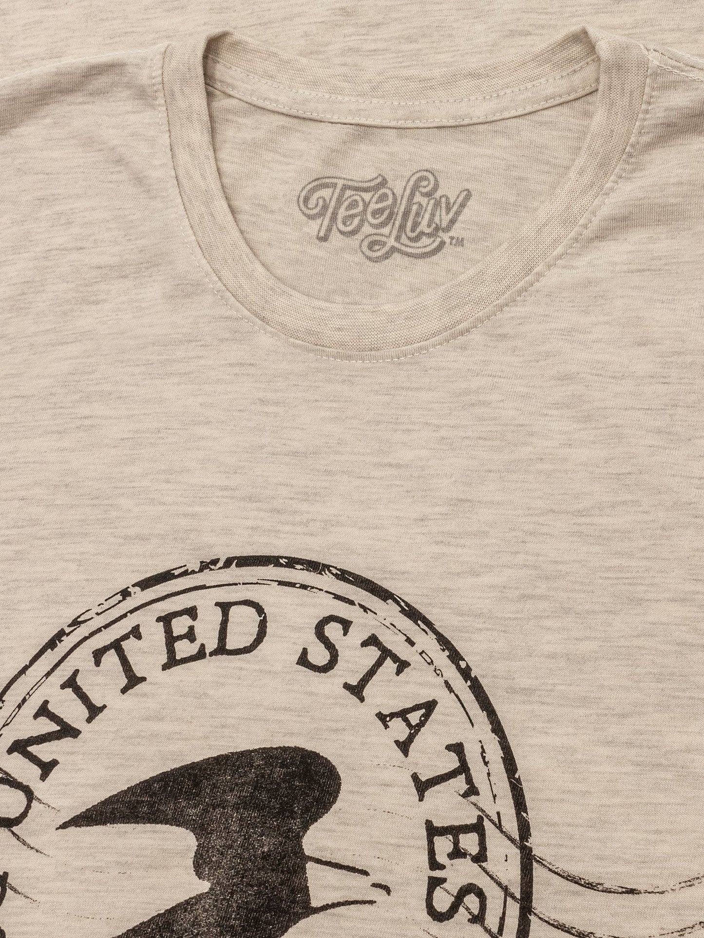 Beige t-shirt with 'United States' and a silhouette design, featuring the TeeLuv brand.