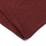 Close-up of a folded brown fabric on a white background