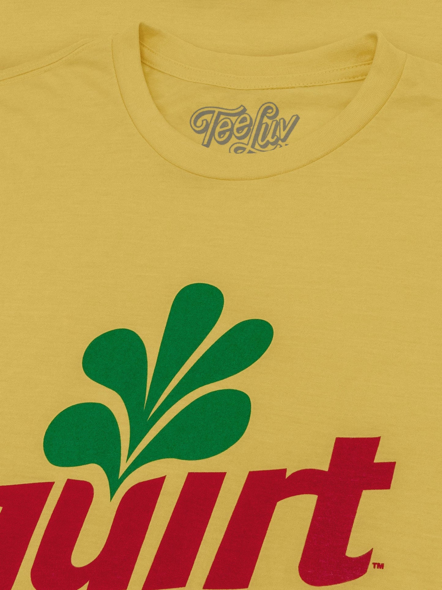 Yellow t-shirt with green leaf logo and red text on a yellow background