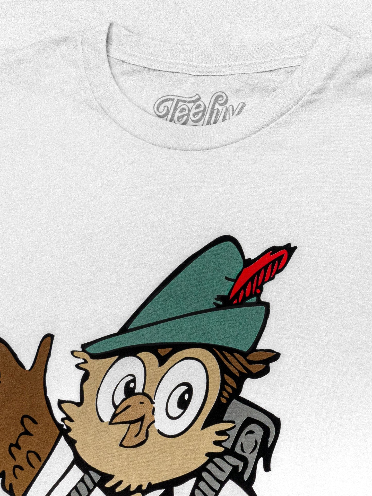 White t-shirt with a cartoon owl design and 'Tee Luv' branding.
