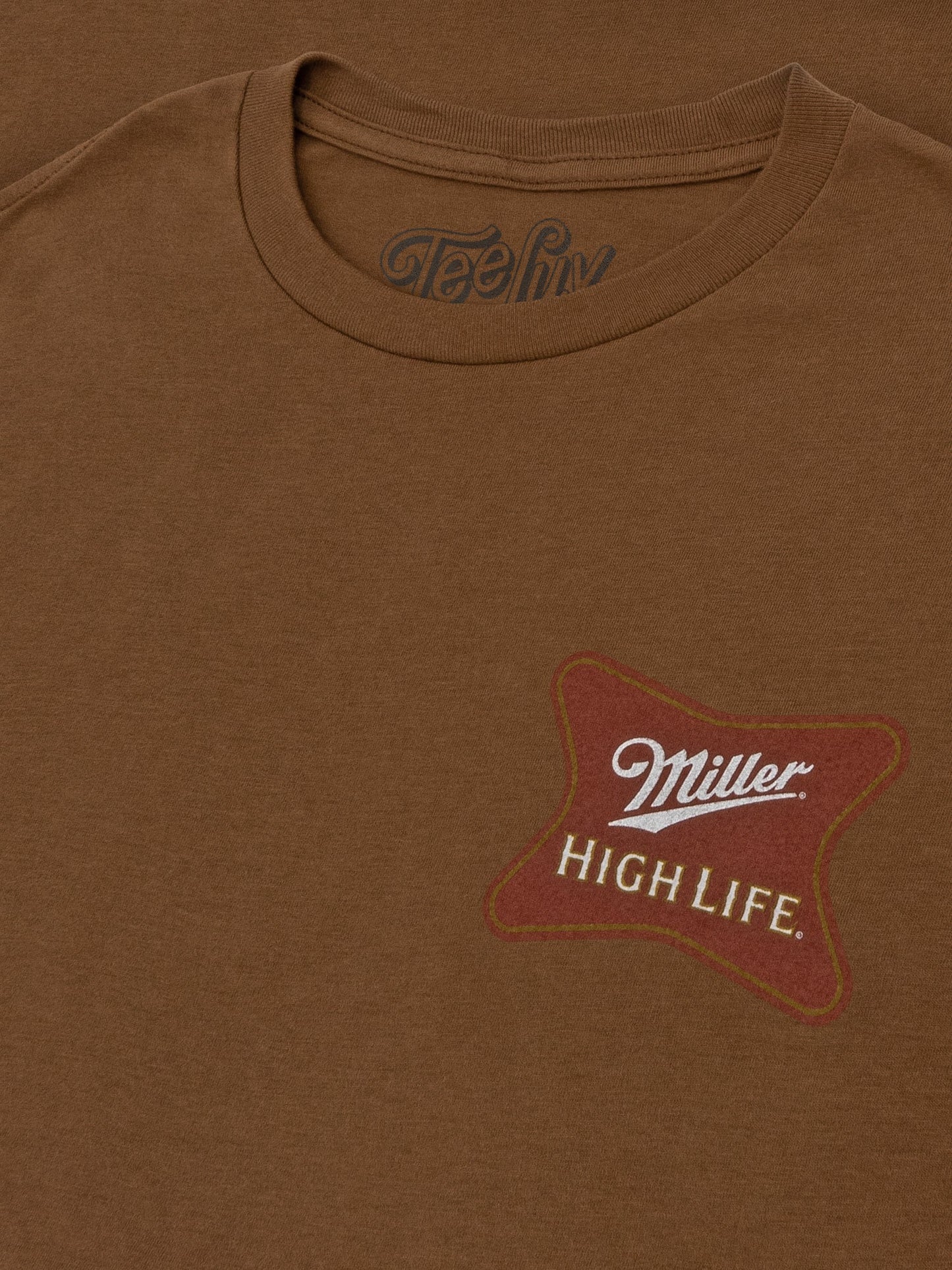 Brown t-shirt with a star-shaped 'Miller High Life' logo on a brown background