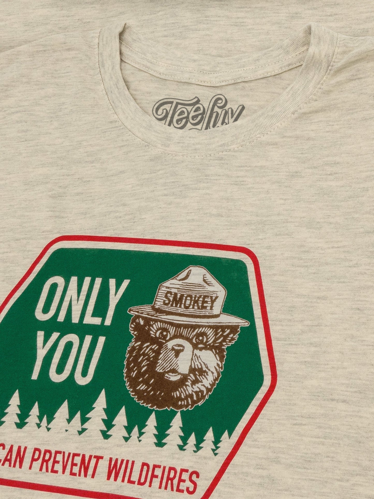 Beige t-shirt with Smokey Bear graphic and 'Only You Can Prevent Wildfires' text.