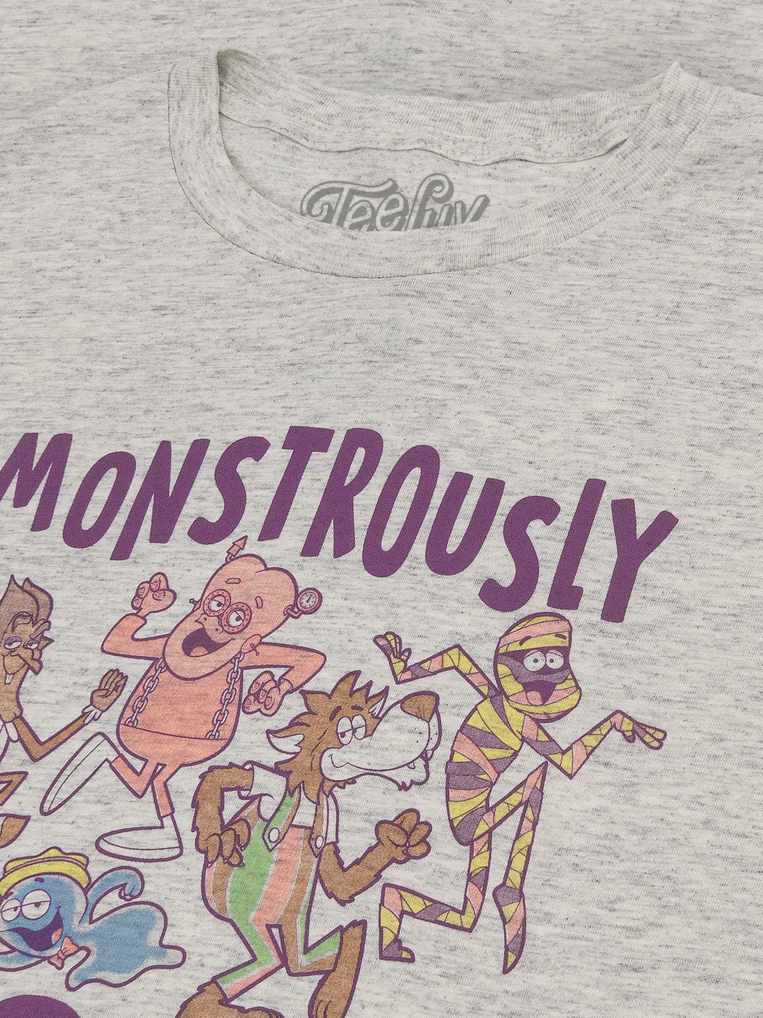 Gray t-shirt with cartoon characters and the word 'MONSTROUSLY' printed on it.