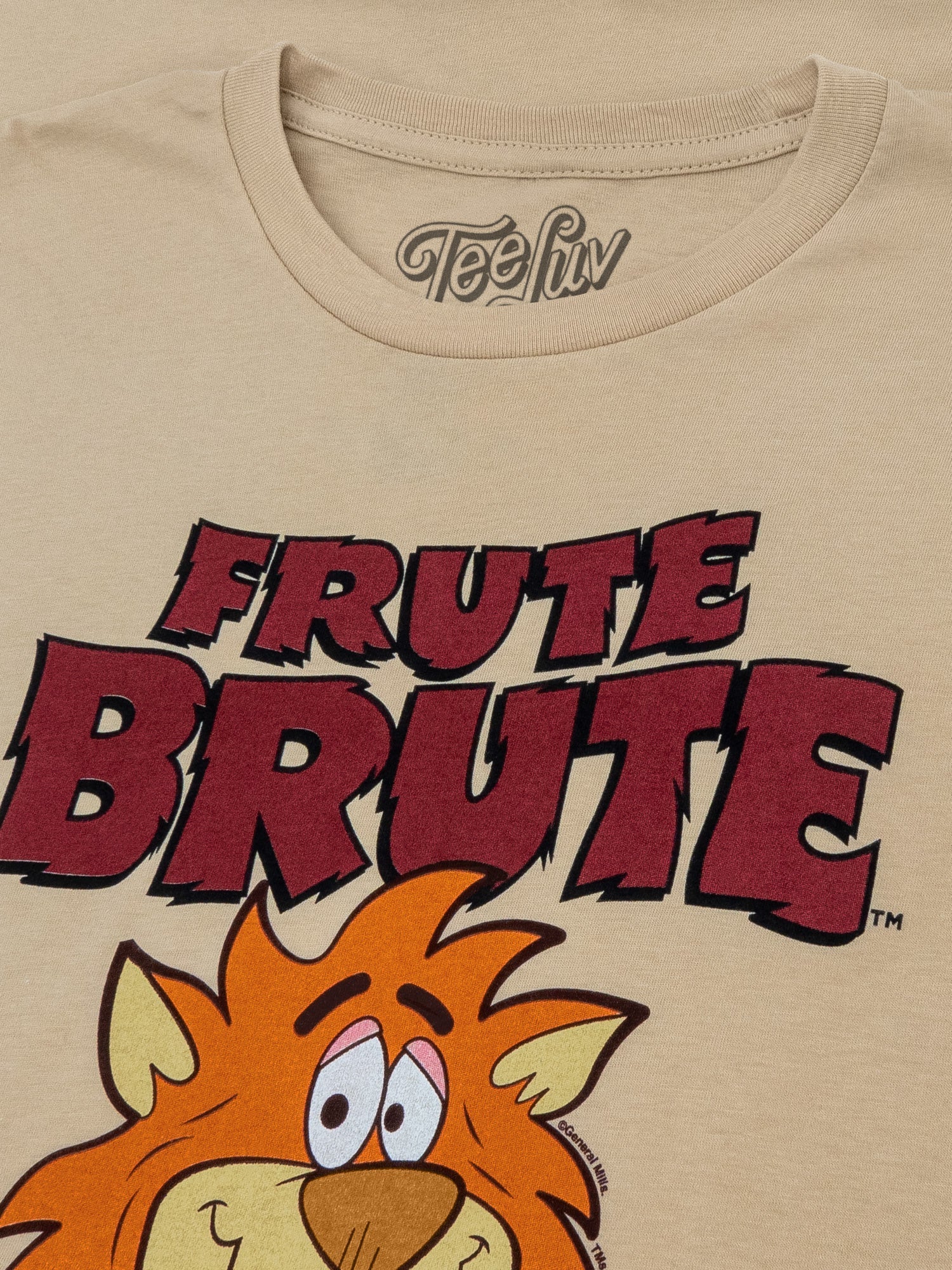 Beige t-shirt with cartoon lion and 'Frute Brute' text, brand 'Teefun' visible.