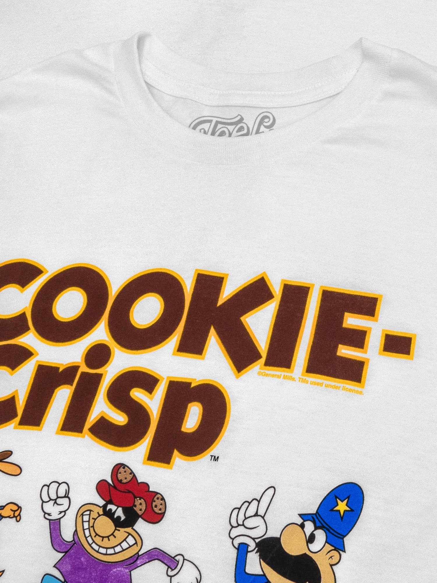 White t-shirt with 'Cookie Crisp' text and cartoon characters on a white background