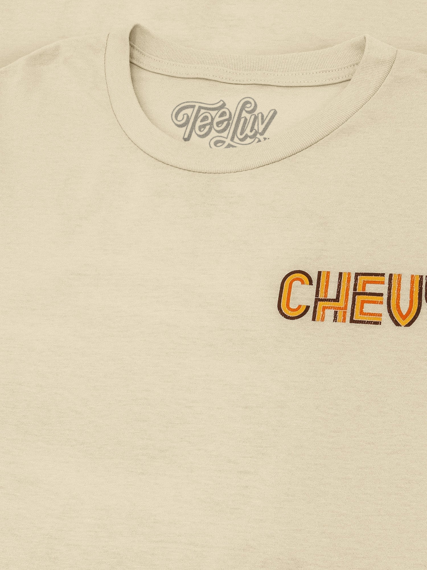 Beige t-shirt with 'Chevy' logo and 'Teely' branding on a beige background