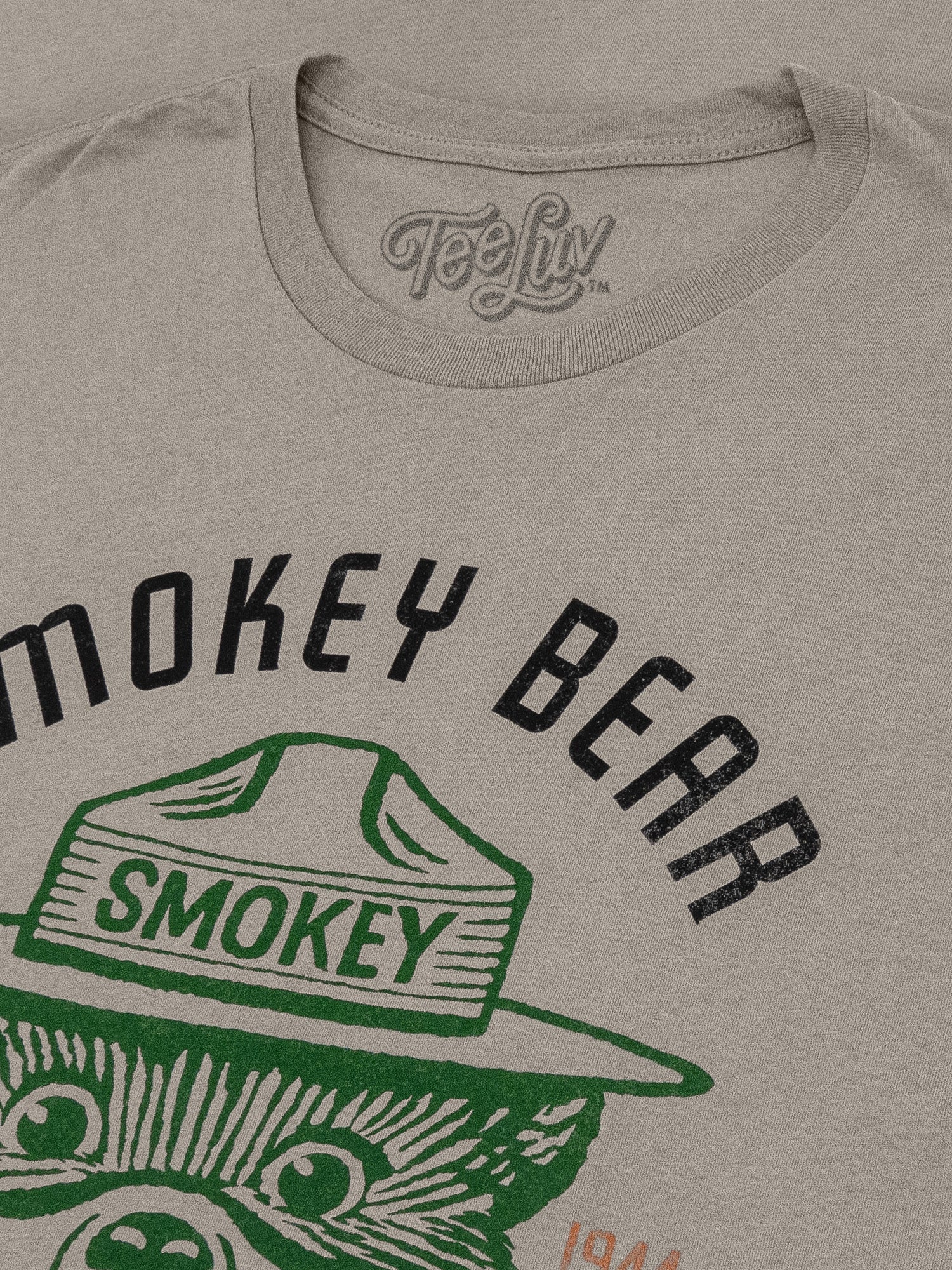 Gray t-shirt with 'Smokey Bear' graphic and 'TeeLuv' branding.