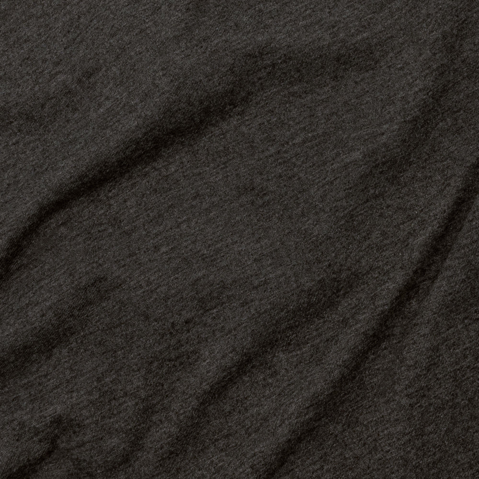 Close-up of dark gray fabric with visible texture
