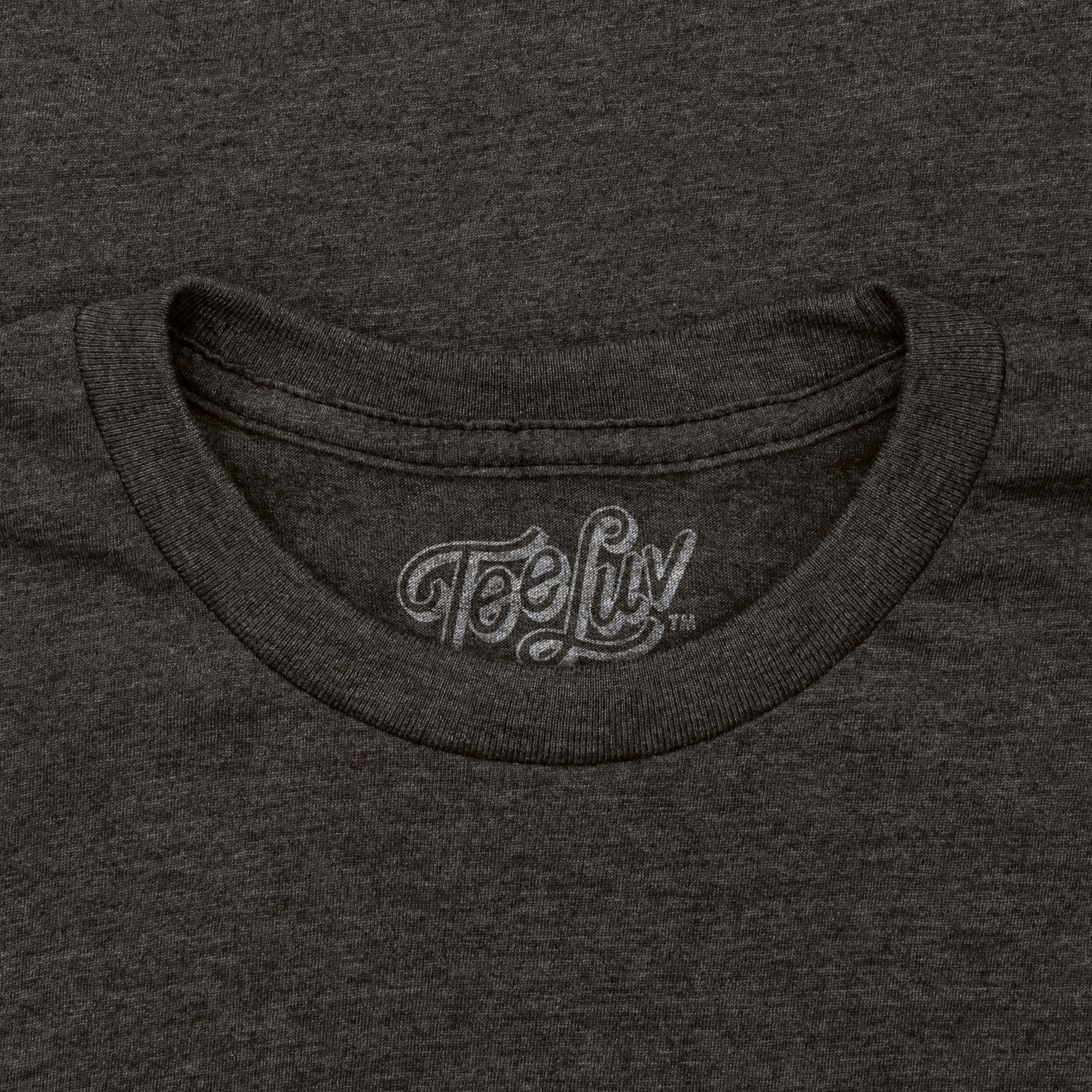 Close-up of a dark gray t-shirt with 'Tee Luv' logo on the collar.