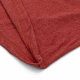 Close-up of a red fabric texture on a white background