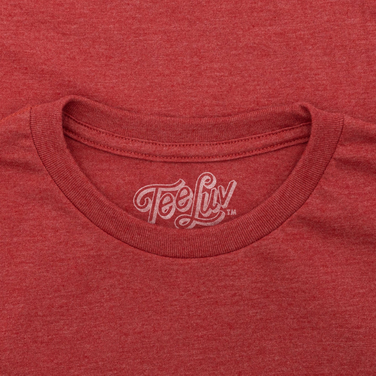 Red t-shirt with 'TeeLuv' logo on the collar