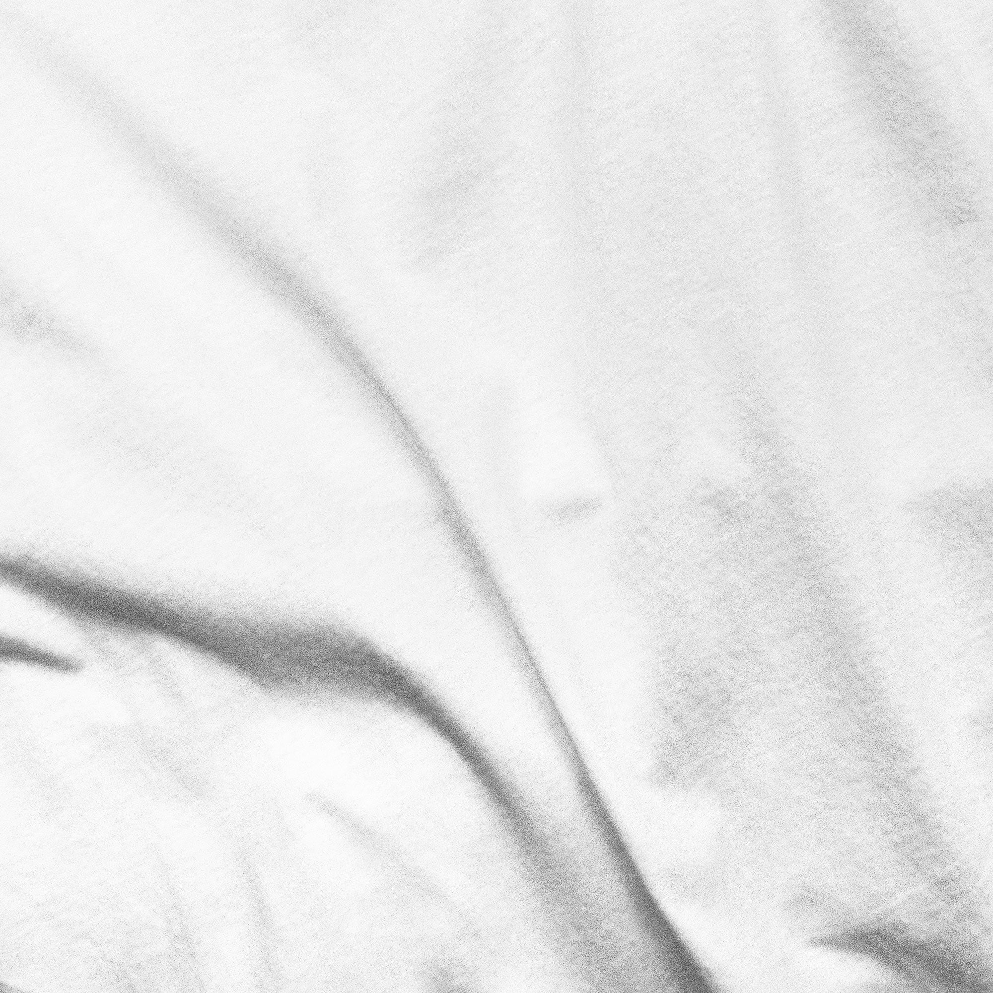 Close-up of white fabric with subtle texture