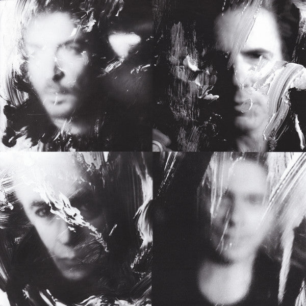 Collage of a person's face with abstract black and white brush strokes.