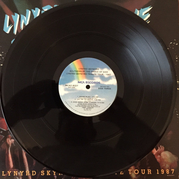 Vinyl record with a label on a Lynyrd Skynyrd album cover